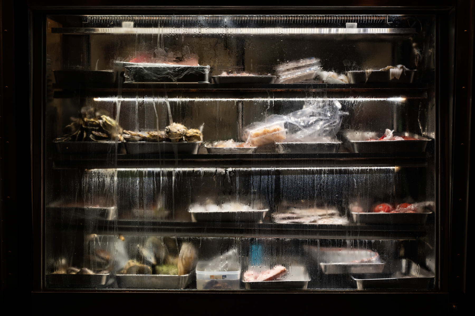 A commercial refrigerator containing food items